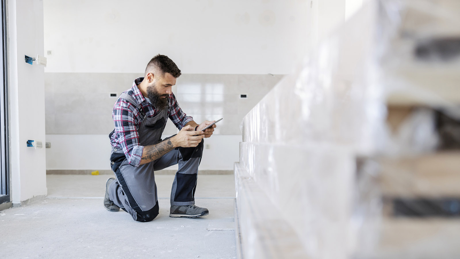 An inspector reviewing construction materials inside a home.