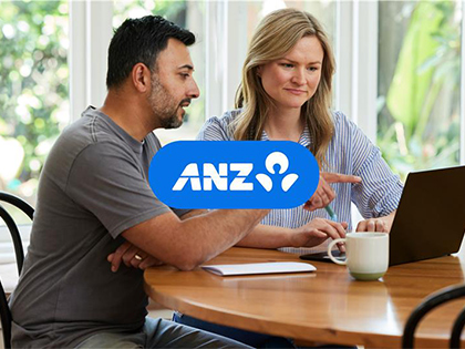 A couple researching financing with ANZ on their laptop.