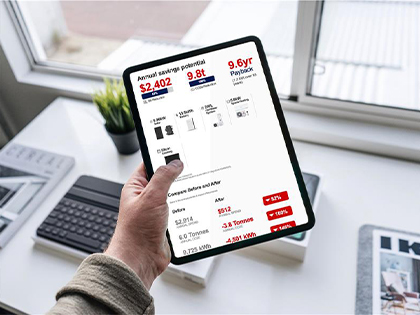 Closeup of a person holding a tablet with an electrify your home sample proposal.